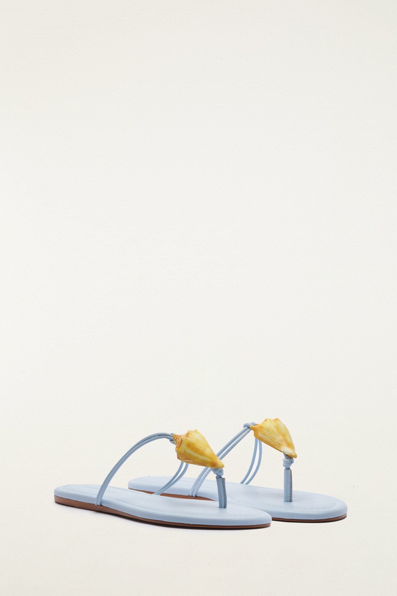 FARM Rio model wearing the Shell Flat Sandal