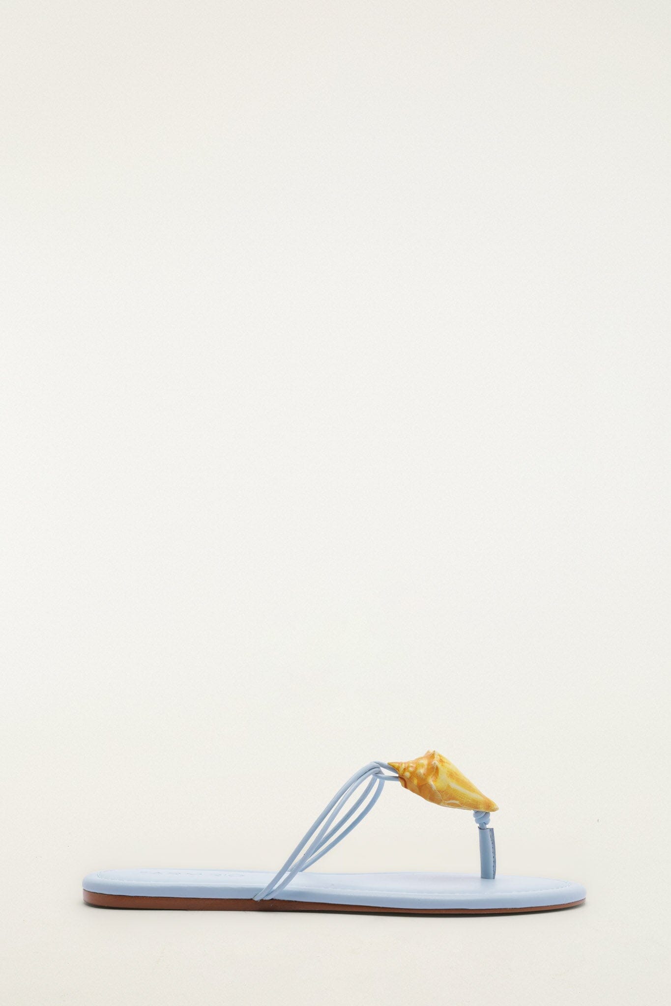 FARM Rio model wearing the Shell Flat Sandal