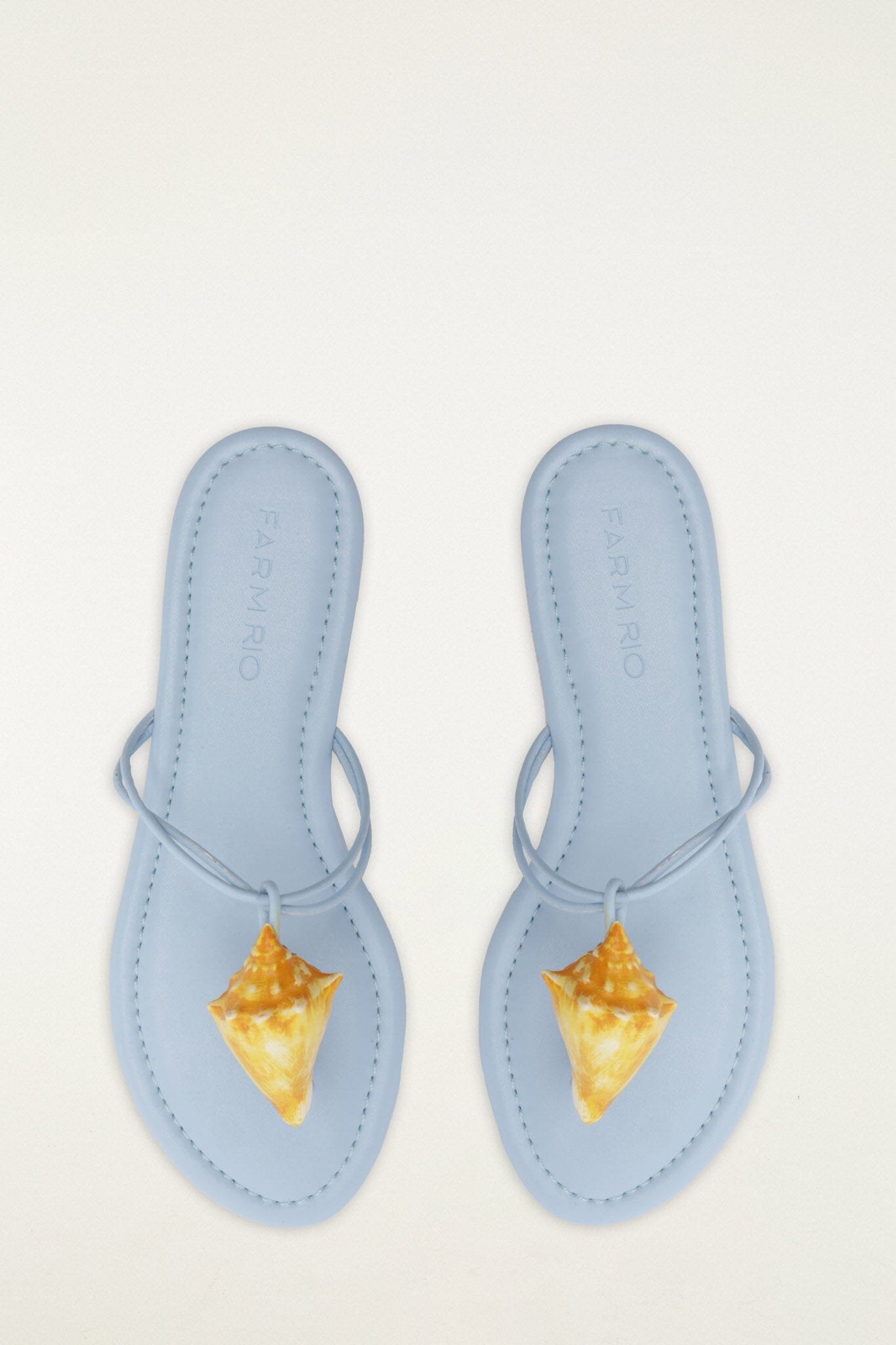 FARM Rio model wearing the Shell Flat Sandal