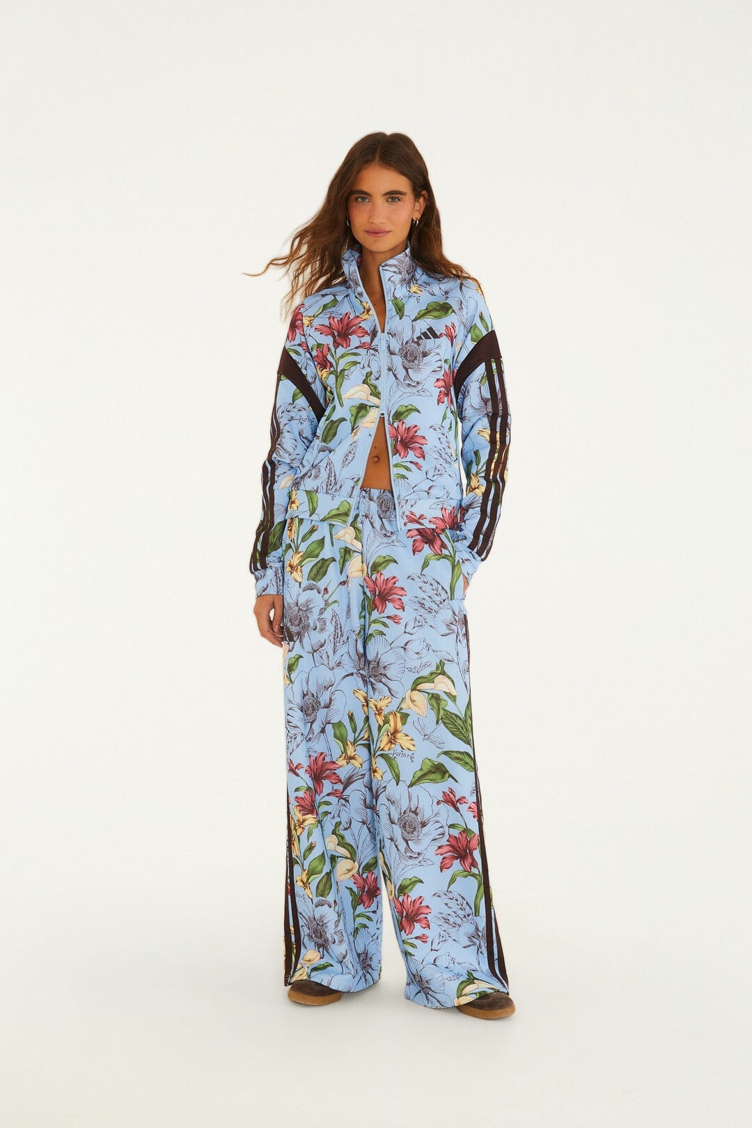 FARM Rio model wearing the Sketch Floral Blue Adidas Tiro Jacket