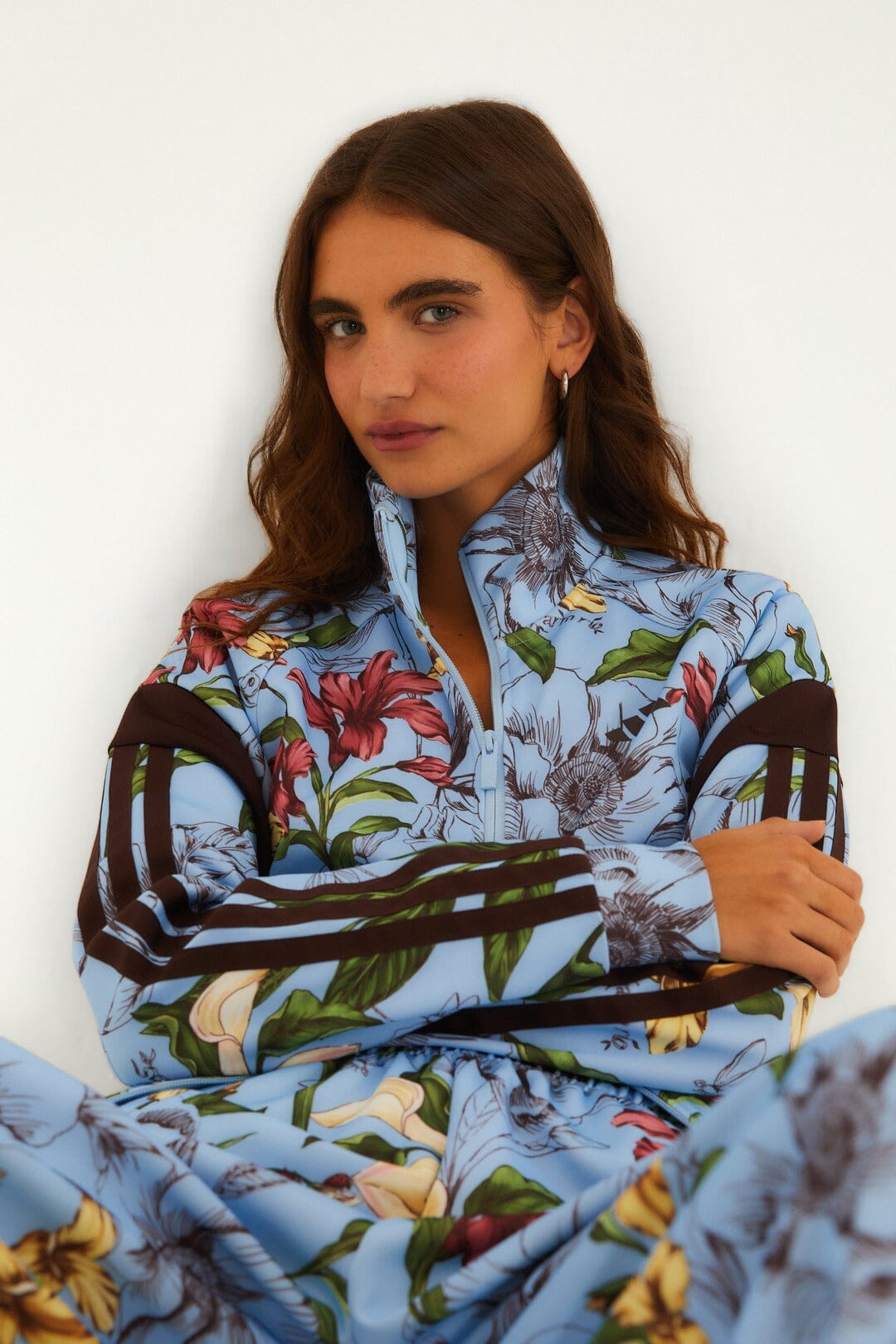 FARM Rio model wearing the Sketch Floral Blue Adidas Tiro Jacket