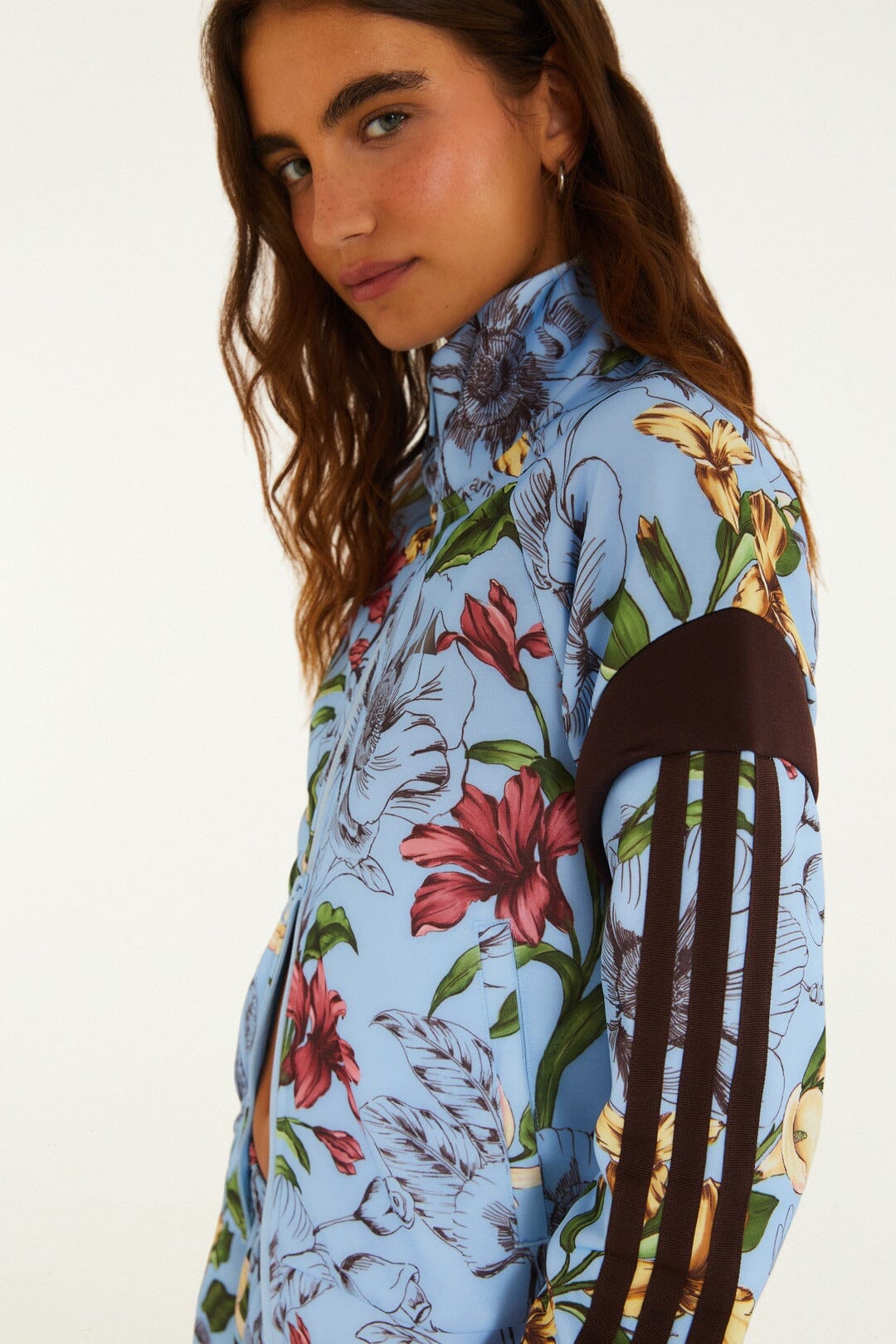 FARM Rio model wearing the Sketch Floral Blue Adidas Tiro Jacket