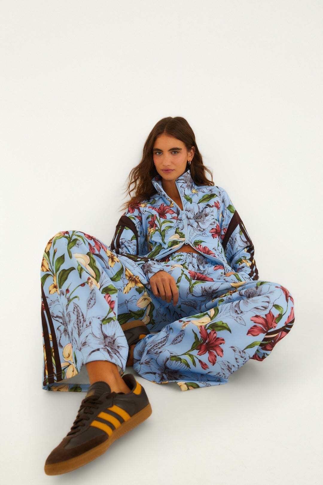 FARM Rio model wearing the Sketch Floral Blue Adidas Tiro Pants