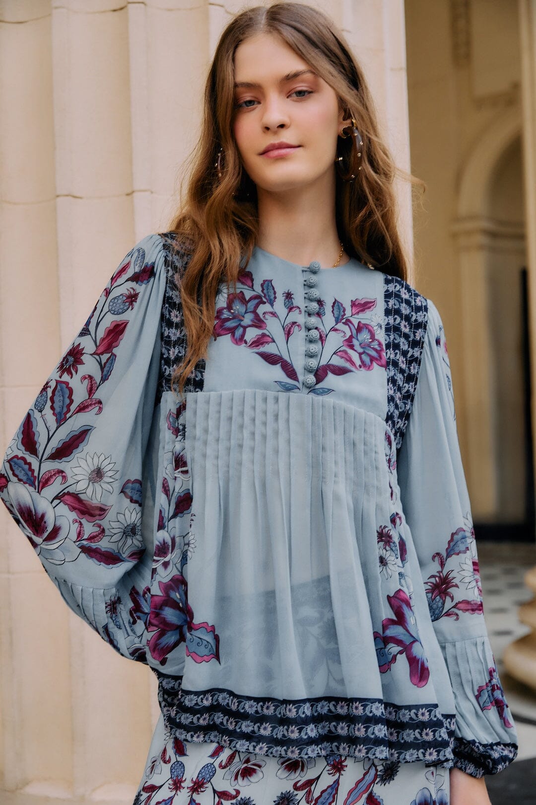 FARM Rio model wearing the Soft Blue Marcelle Crochet Buttons Pleated Blouse