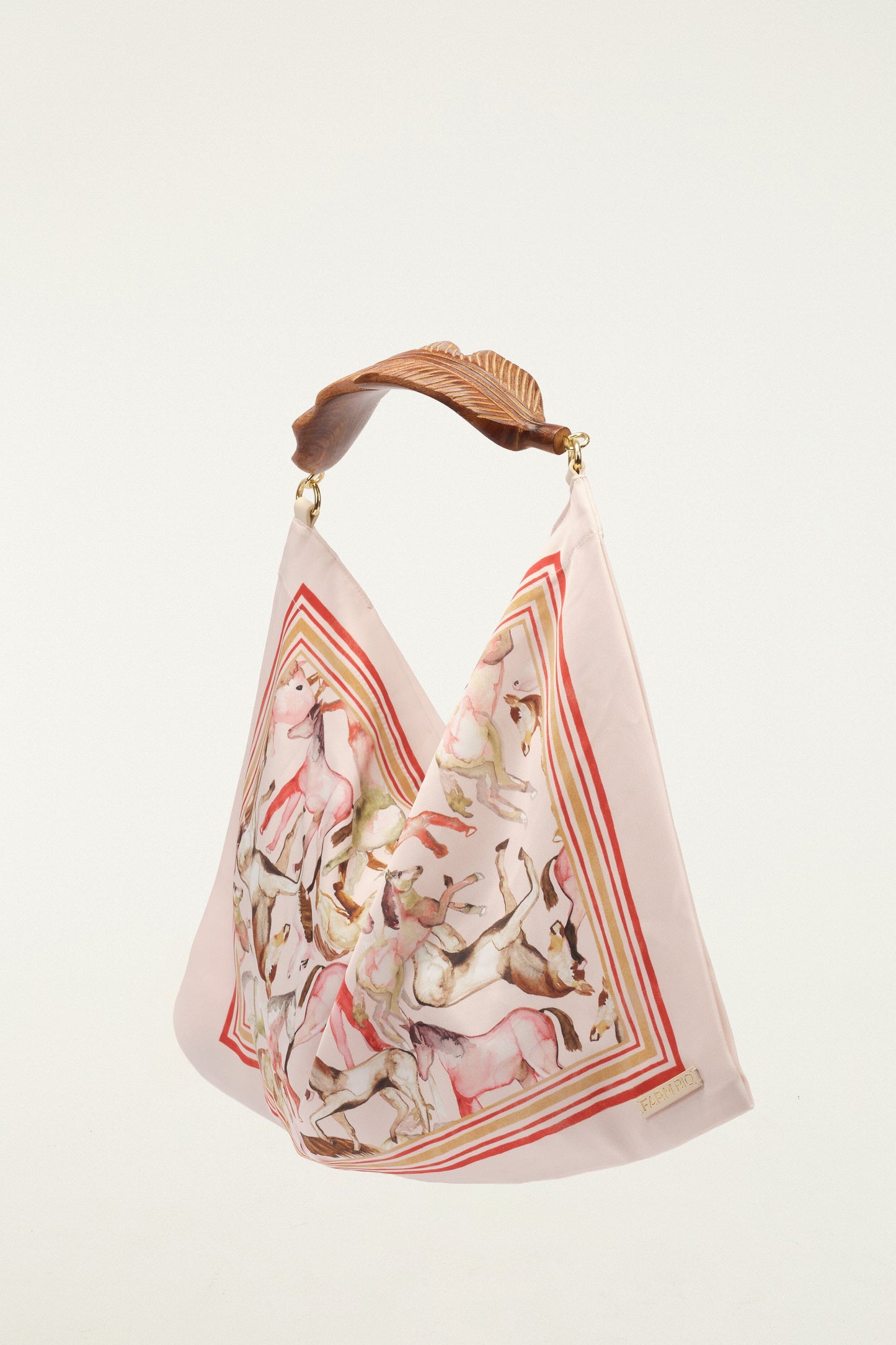 FARM Rio model wearing the Soft Pink Horses Satin Small Scarf Bag