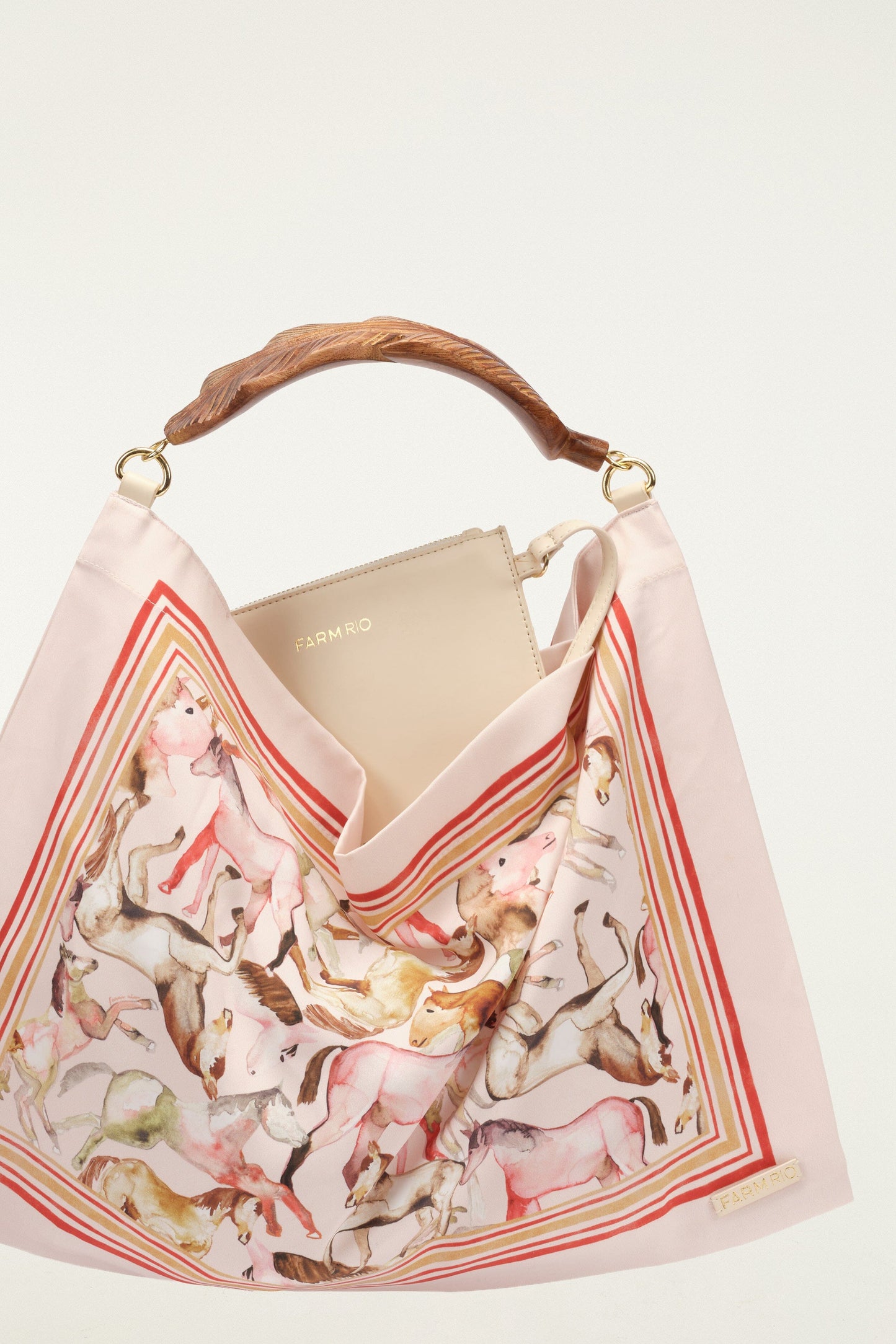 FARM Rio model wearing the Soft Pink Horses Satin Small Scarf Bag