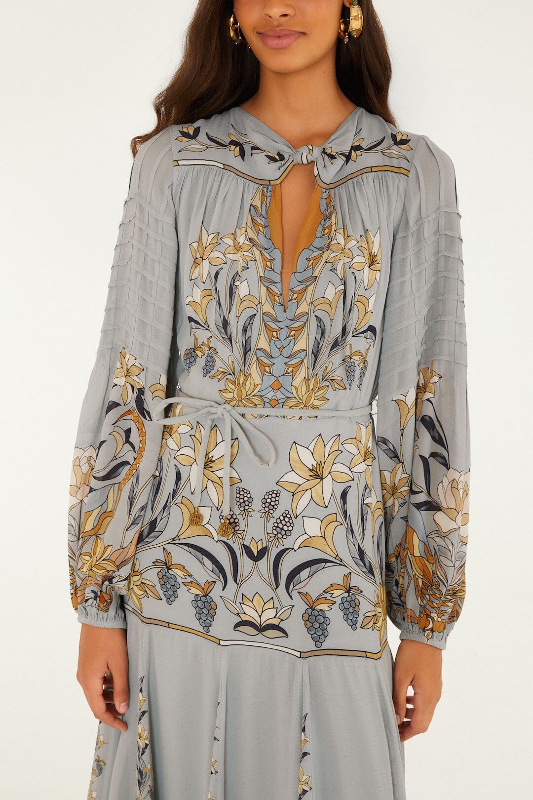 FARM Rio model wearing the Stained Glass Beauty Long Sleeve Pleated Maxi Dress