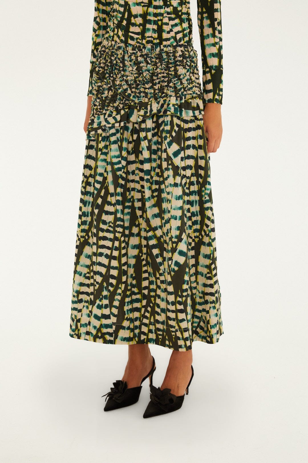 FARM Rio model wearing the Striped Leaves Smocked Maxi Skirt