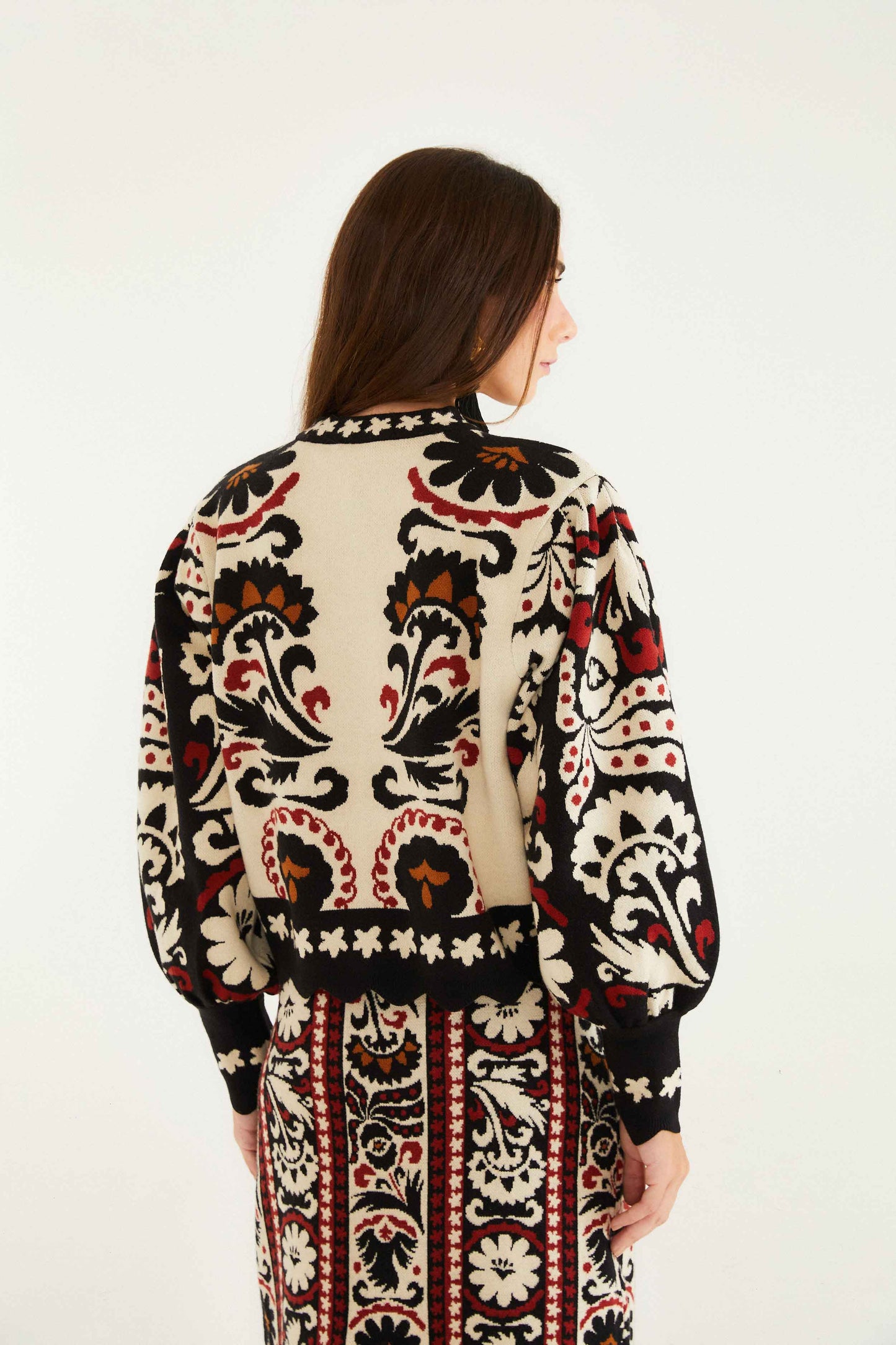 FARM Rio model wearing the Stripes Winter Tapestry Knit Sweater