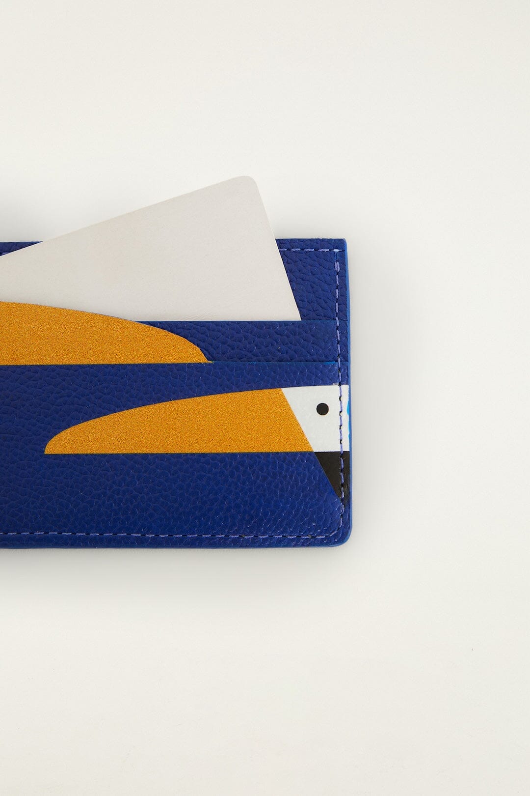 FARM Rio model wearing the Toucan Card Holder