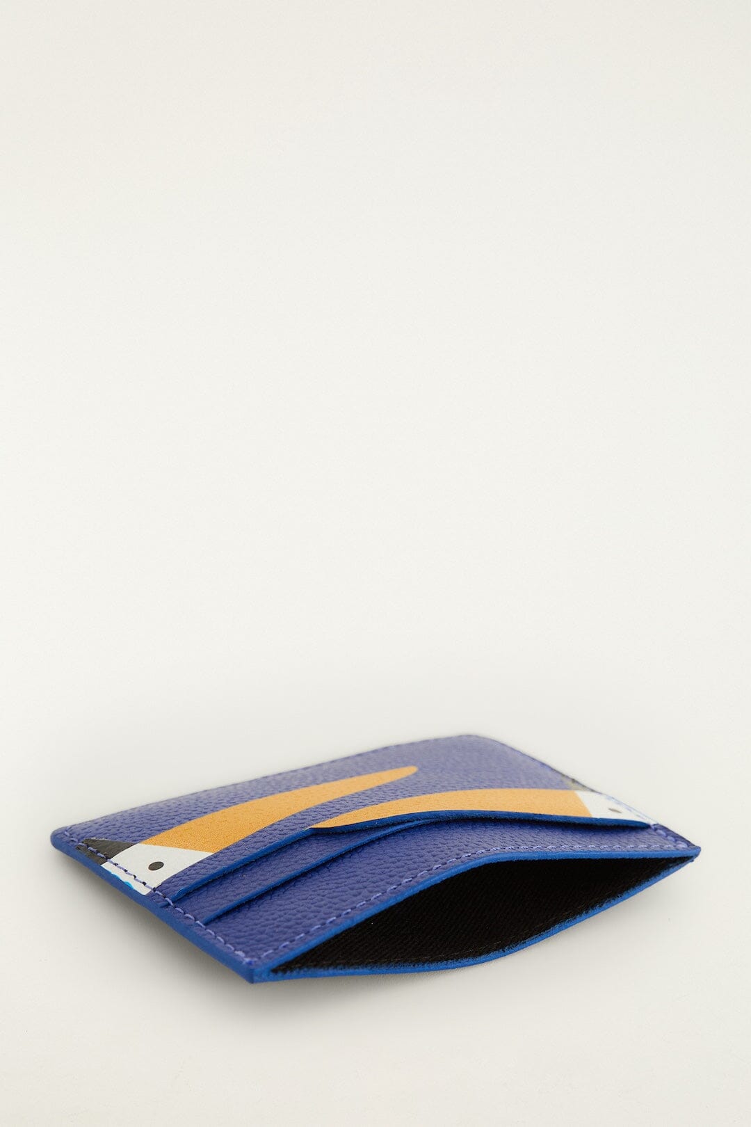 FARM Rio model wearing the Toucan Card Holder