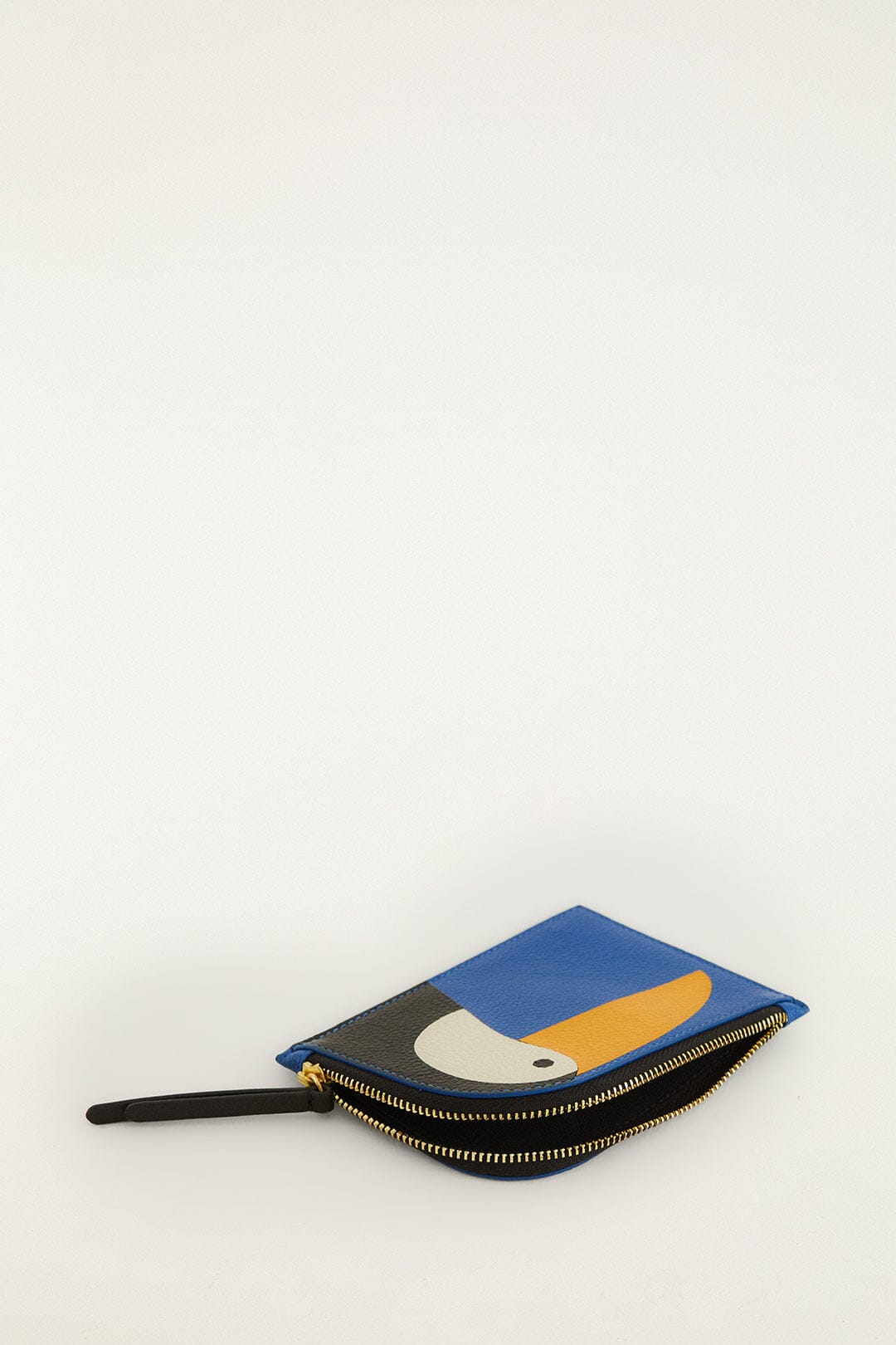 FARM Rio model wearing the Toucan Wallet