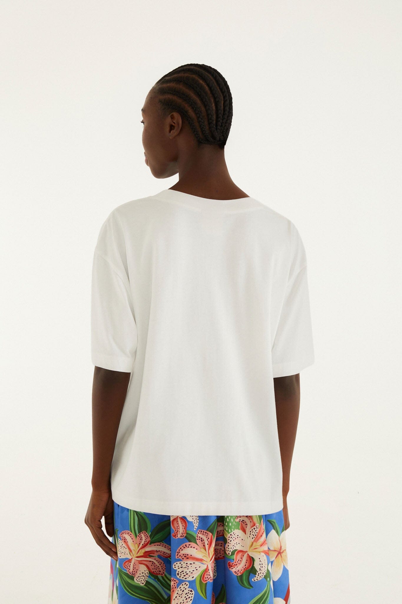 FARM Rio model wearing the White Tropical Rose Organic Cotton T-Shirt