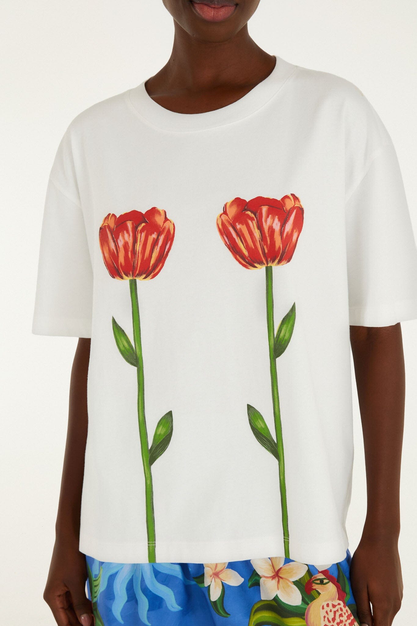 FARM Rio model wearing the White Tropical Rose Organic Cotton T-Shirt