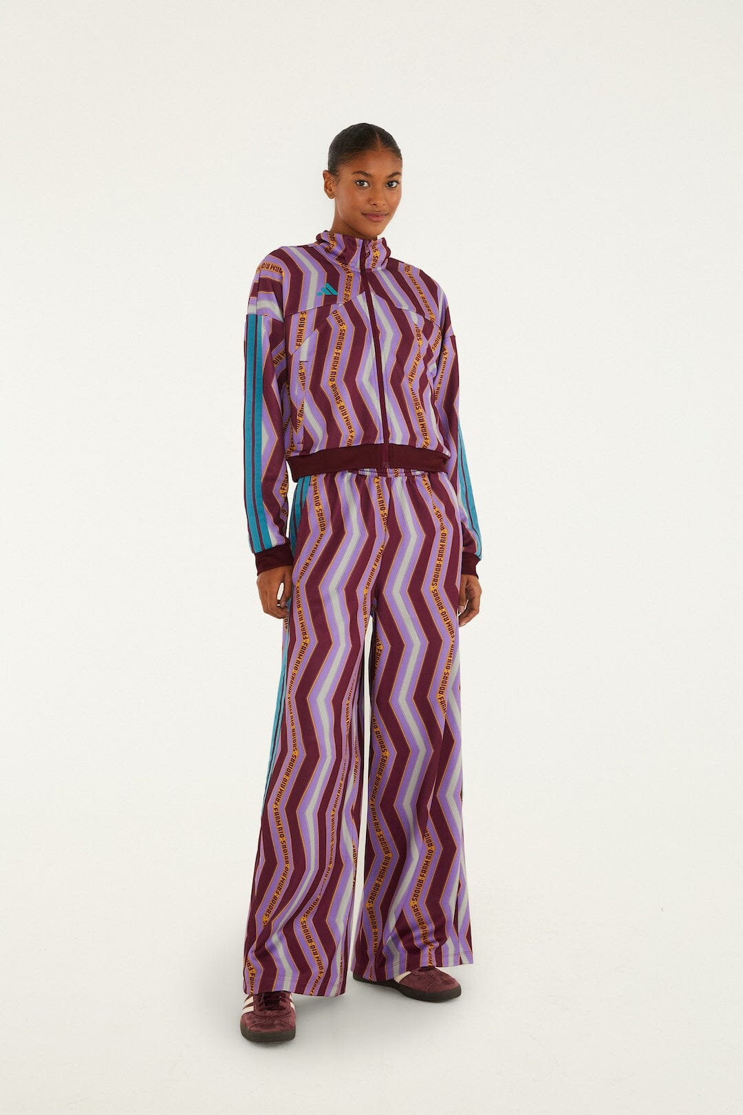FARM Rio model wearing the Zig Zag Stripes Lilac Adidas Tiro Pants